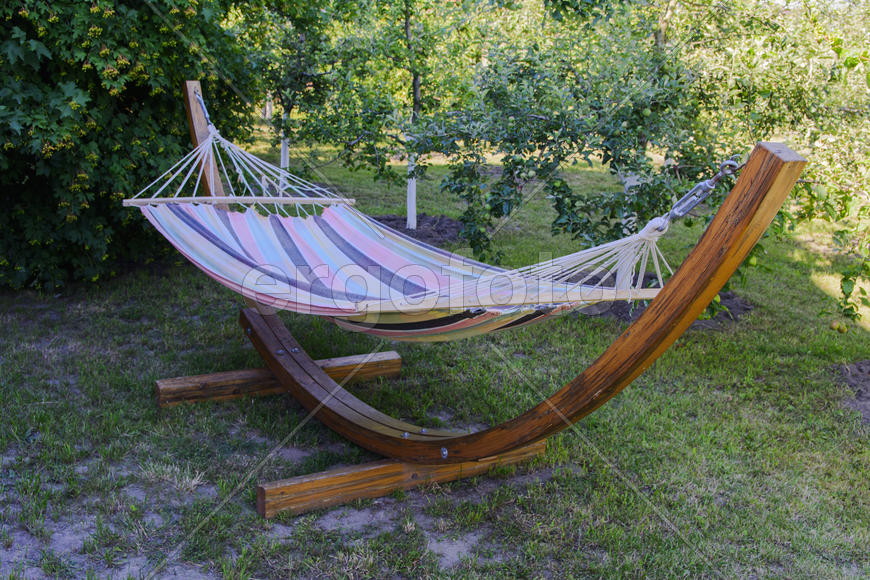 Fixing the hammock in the yard of a private house