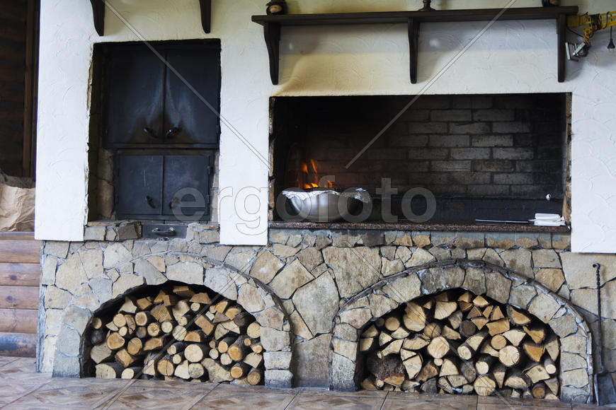 Firewood stacked near the stove near a private house