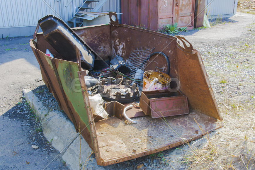 Old rusty engine in an abandoned factory in the industrial zone