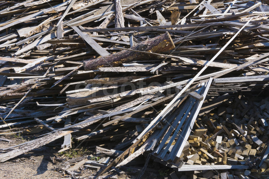 A pile of old boards in an abandoned factory in the industrial zone