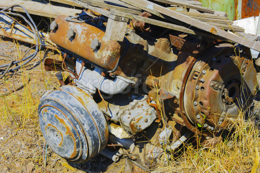 Old rusty engine in an abandoned factory in the industrial zone