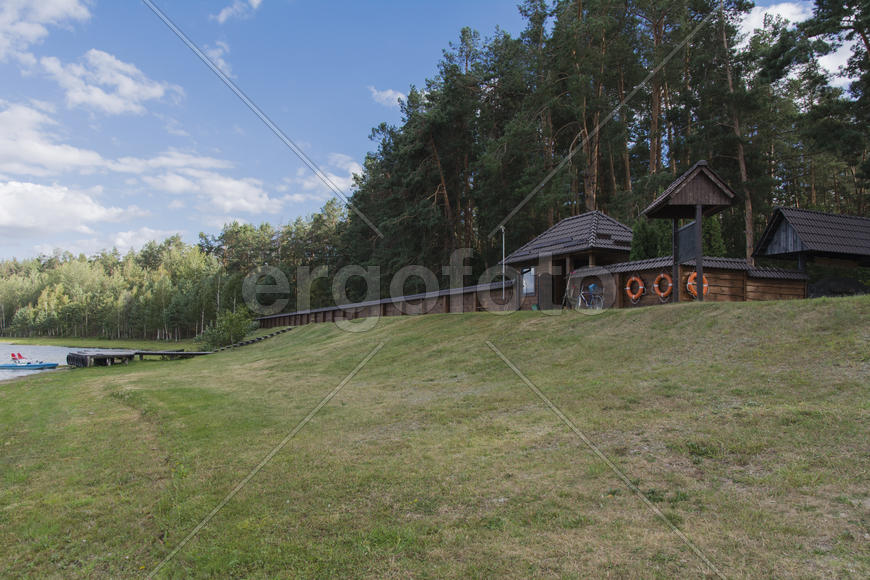 Wooden fence enclosing the recreation area on the lake