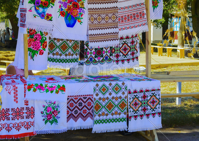 Sale of hand-embroidered fabrics at the fair in the village