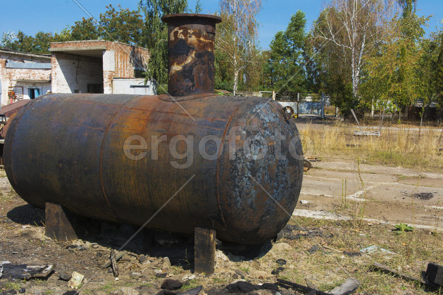 Old rusty container at an abandoned factory in the industrial zone