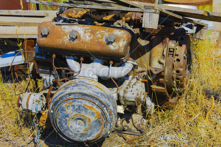 Old rusty engine in an abandoned factory in the industrial zone