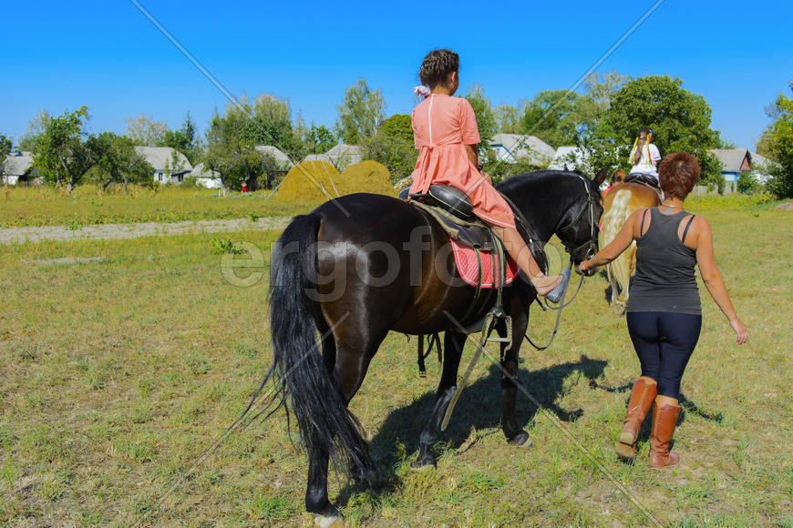 Horseback riding at the fair in the village