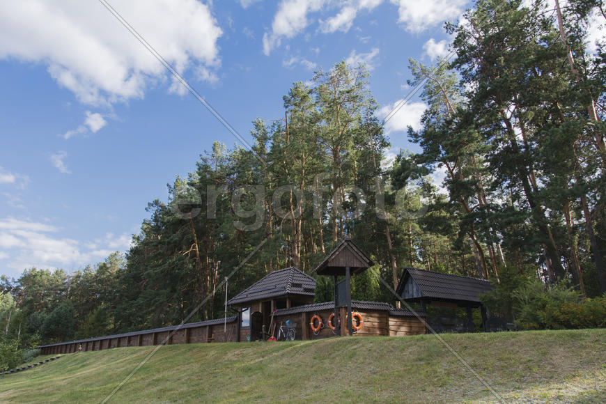 Wooden fence enclosing the recreation area on the lake