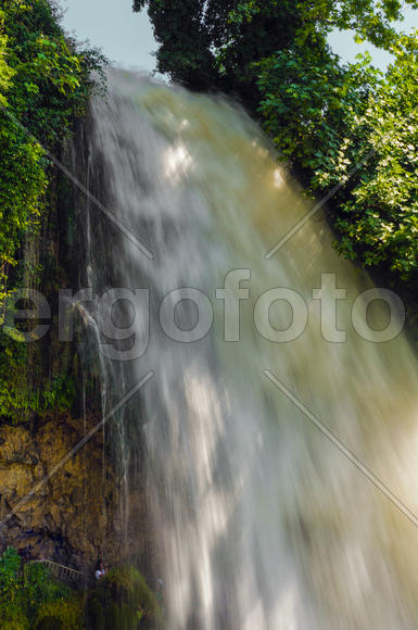 Waterfall. drop of water in the river from the ledge. The sharp drop height of the riverbed and a st