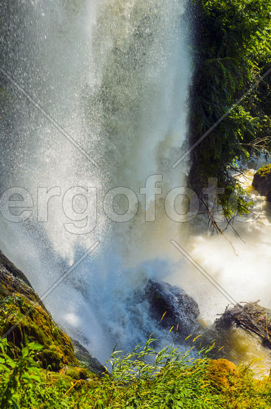 Waterfall. drop of water in the river from the ledge. The sharp drop height of the riverbed and a st