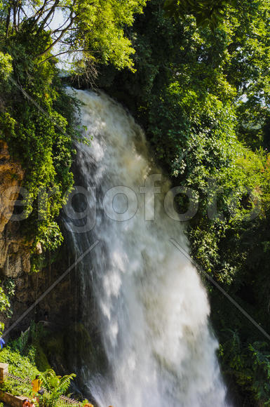 Waterfall. drop of water in the river from the ledge. The sharp drop height of the riverbed and a st