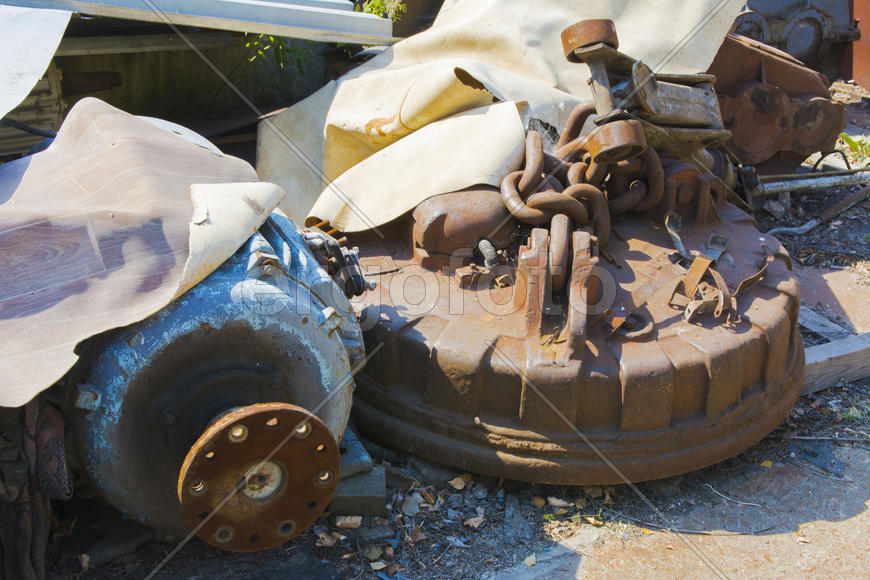 Old rusty engine in an abandoned factory in the industrial zone