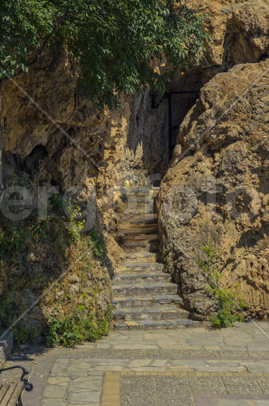 The cave entrance. Natural underground cavity that is available for humans.