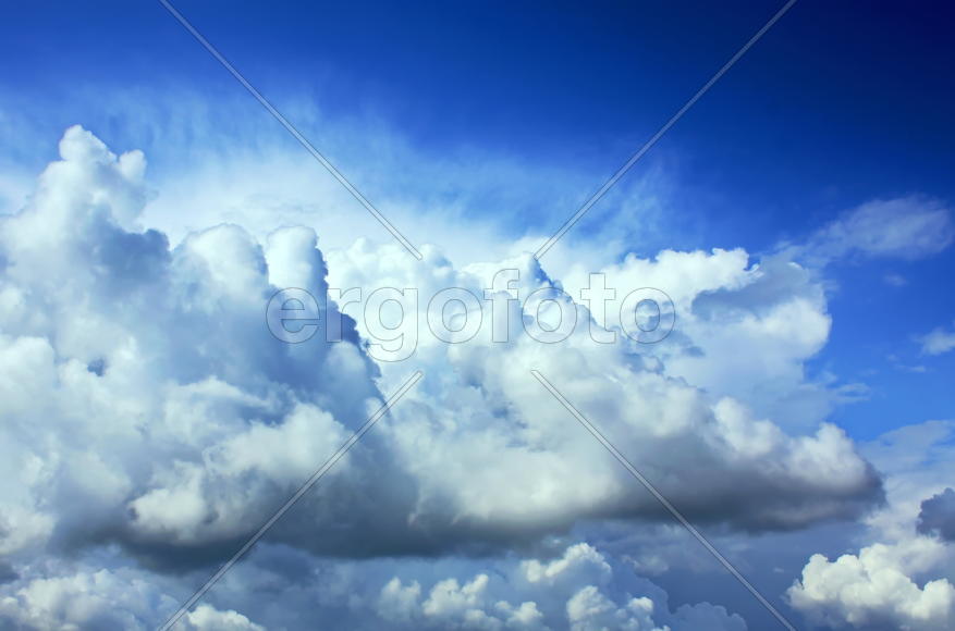 Volumetric clouds against the clear blue sky
