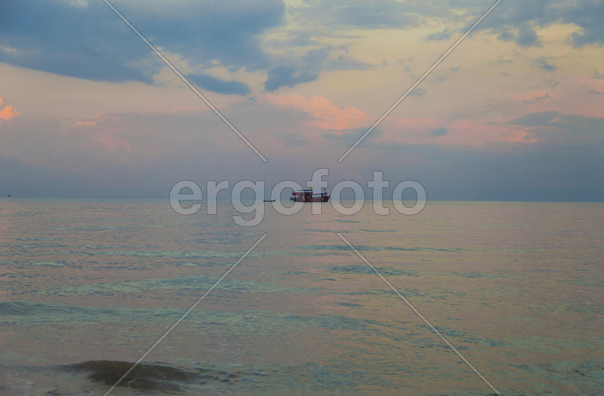 The seashore at sunrise absolutely silent waiting for the sun and people