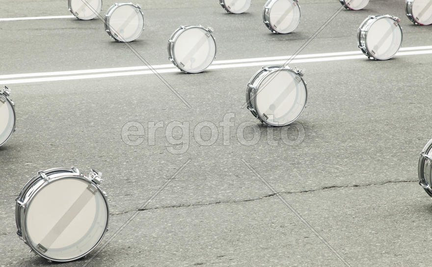 Drums on asphalt wait for drummers for march