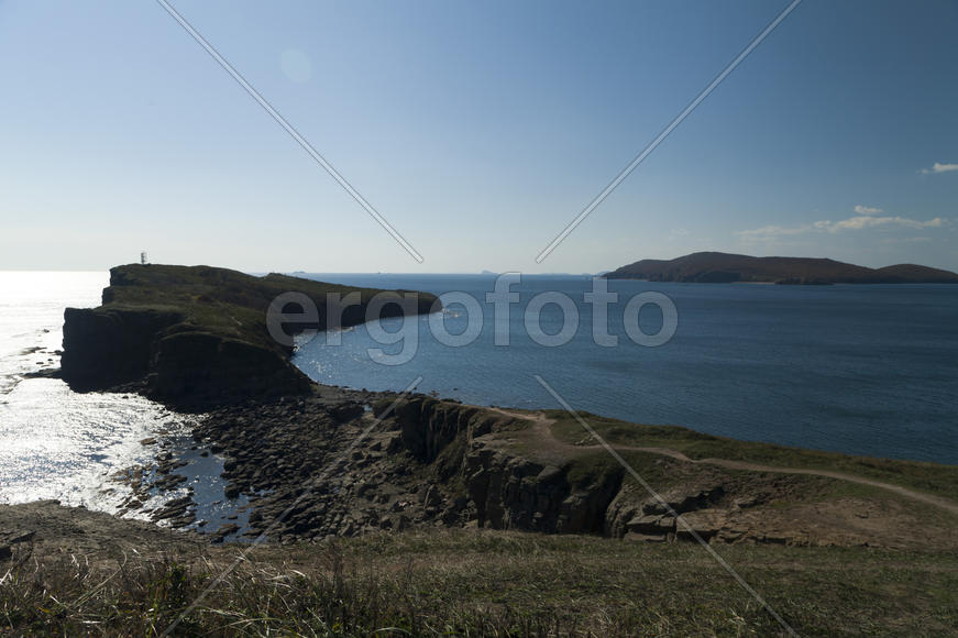 The sea under the bright autumn sun prepares for winter