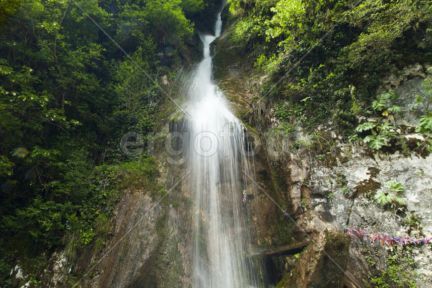 The falls in mountains fall from big height and strongly rustle