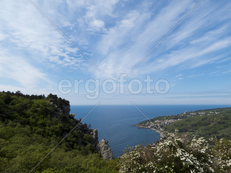 The sea and mountains in beams of a bright sun