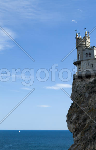 The castle by the sea is on the rock highly above water