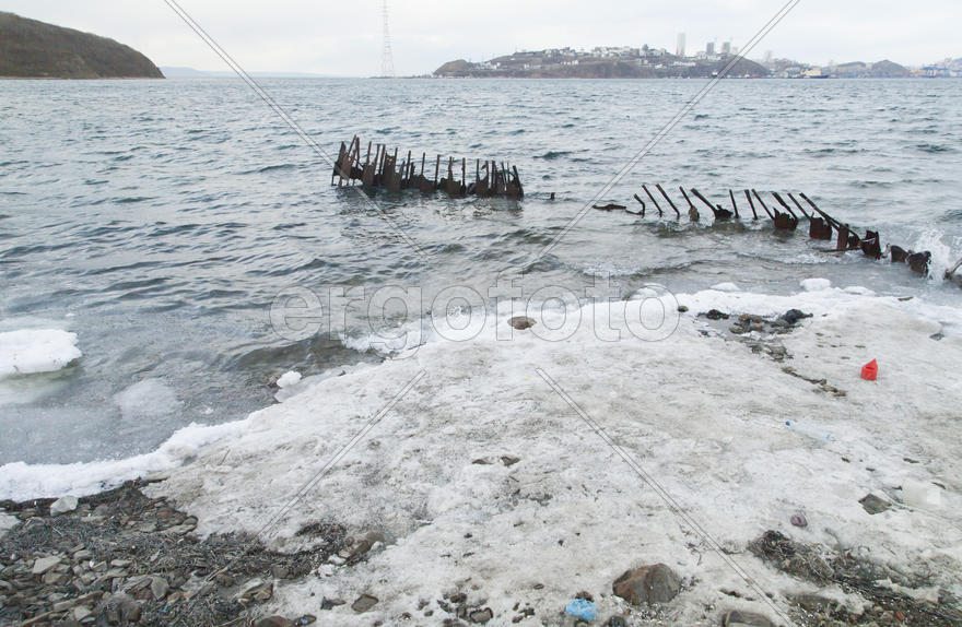Ice at the sea in the early spring yet not all has descended