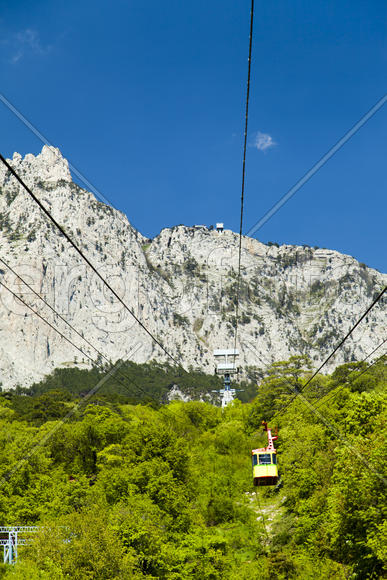 Ropeway on the high mountain in the sunny day