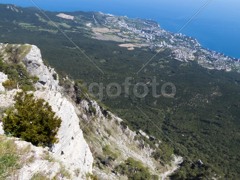 The seashore in the light of the sun from big height