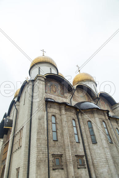 The orthodox church in cloudy weather lights the world with the domes