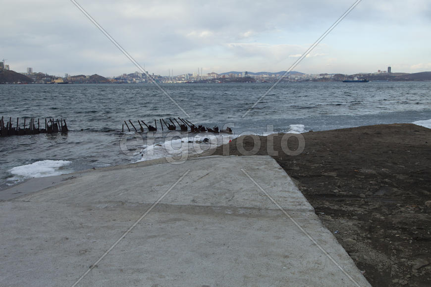 Ice at the sea in the early spring yet not all has descended