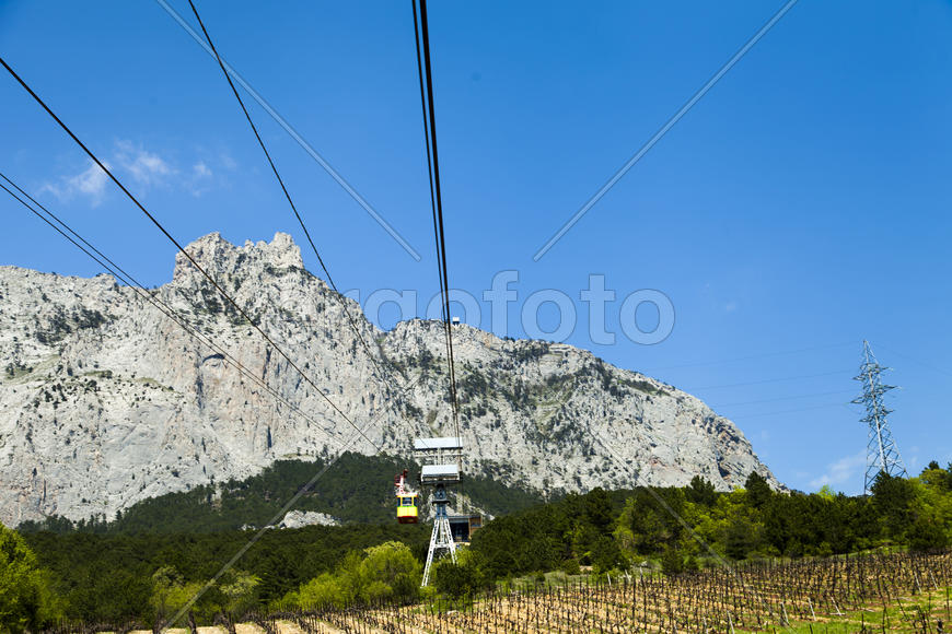 Ropeway on the high mountain in the sunny day