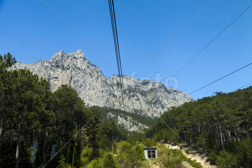 Ropeway on the high mountain in the sunny day
