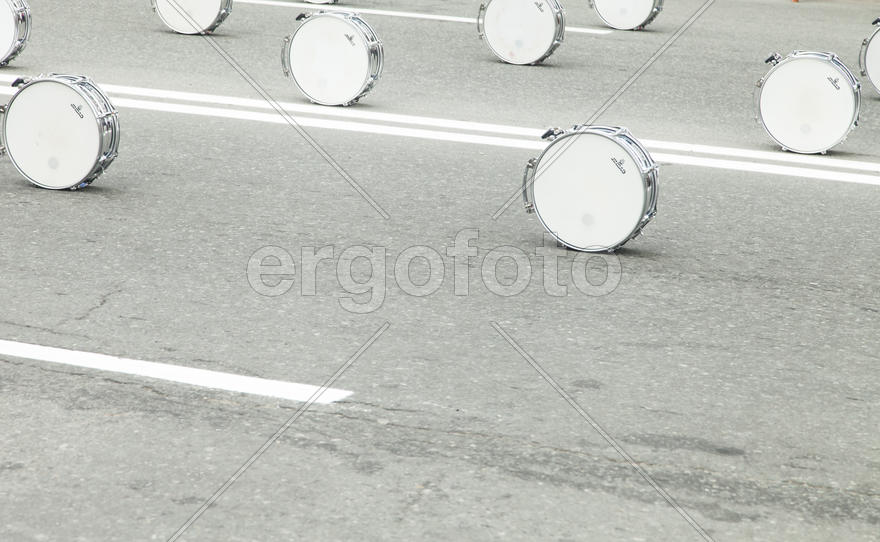 Drums on asphalt wait for drummers for march