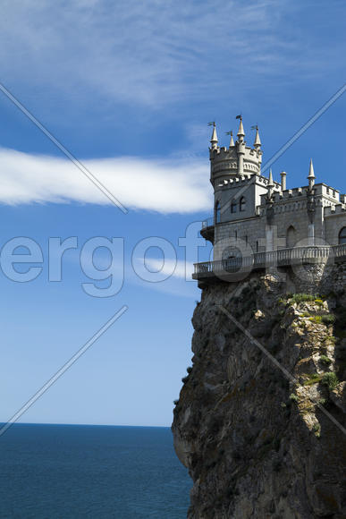 The castle by the sea is on the rock highly above water