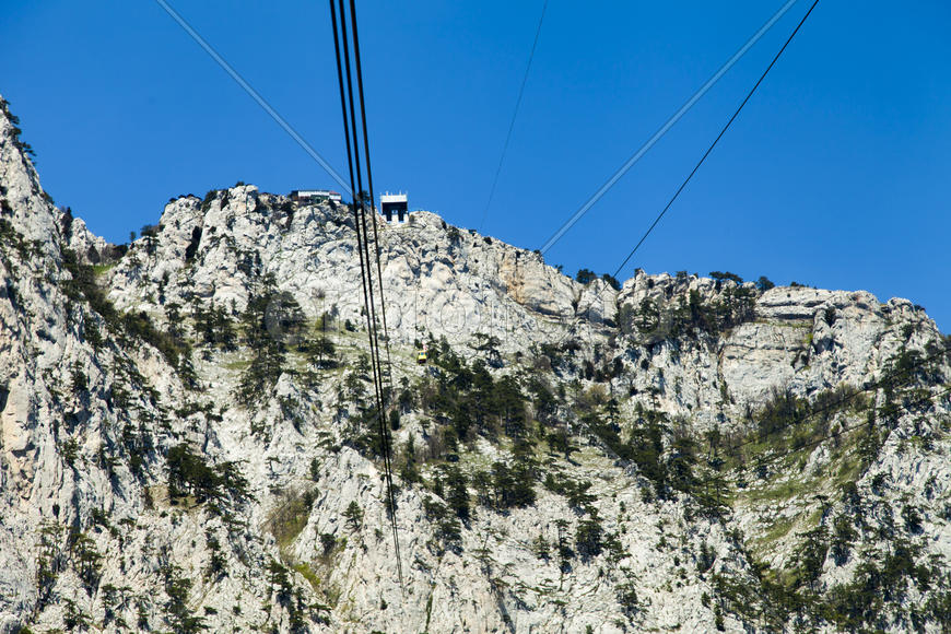 Ropeway on the high mountain in the sunny day