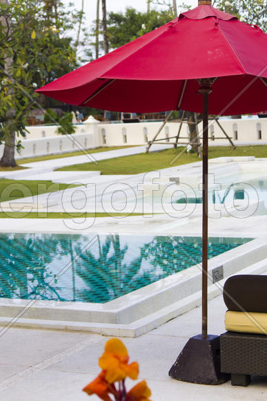 Umbrellas at the pool wait for visitors early in the morning