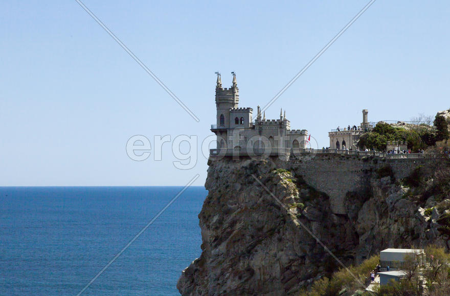 The castle by the sea is on the rock highly above water