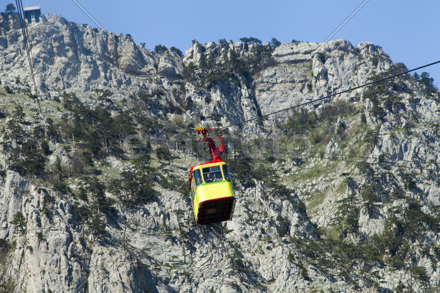 Ropeway on the high mountain in the sunny day