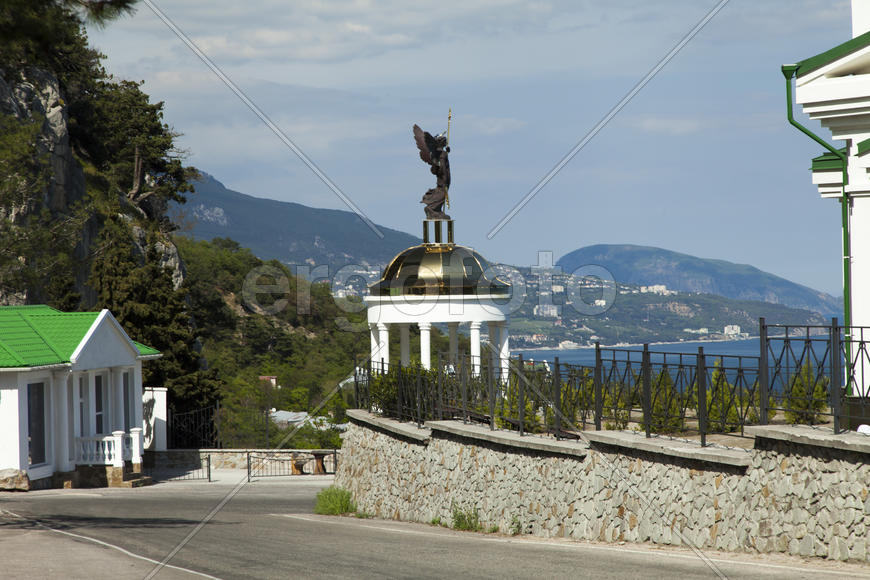 Orthodox church in beams of a bright sun against the blue sky