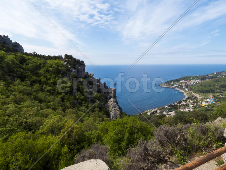 The sea and mountains in beams of a bright sun