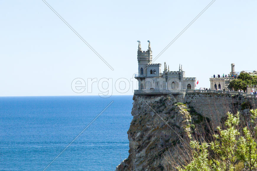 The castle by the sea is on the rock highly above water