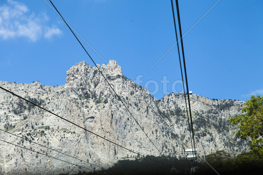 Ropeway on the high mountain in the sunny day
