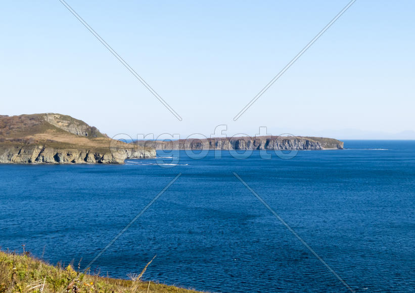 The sea under the bright autumn sun prepares for winter
