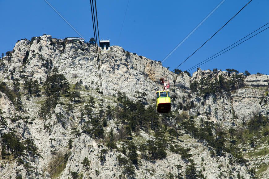 Ropeway on the high mountain in the sunny day