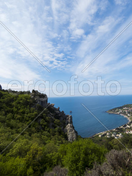 The sea and mountains in beams of a bright sun