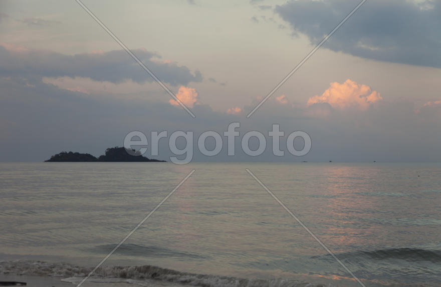 The seashore at sunrise absolutely silent waiting for the sun and people