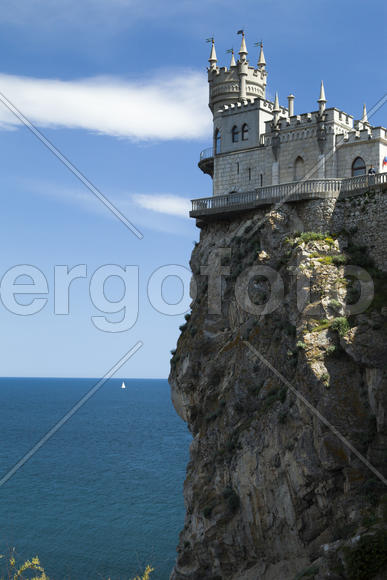 The castle by the sea is on the rock highly above water