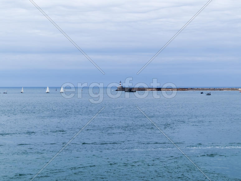 Sea bay in the city in cloudy weather