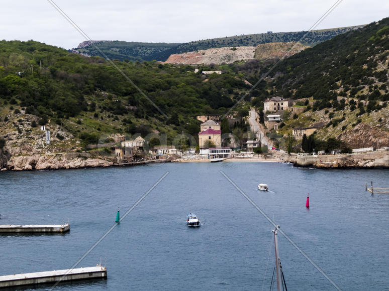 Sea bay in the city in cloudy weather