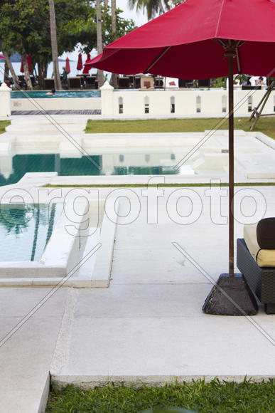 Umbrellas at the pool wait for visitors early in the morning