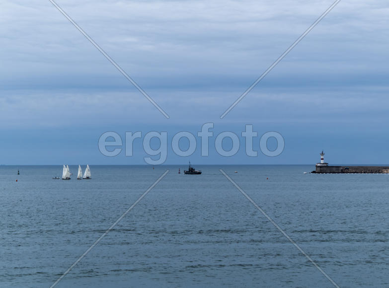 Sea bay in the city in cloudy weather