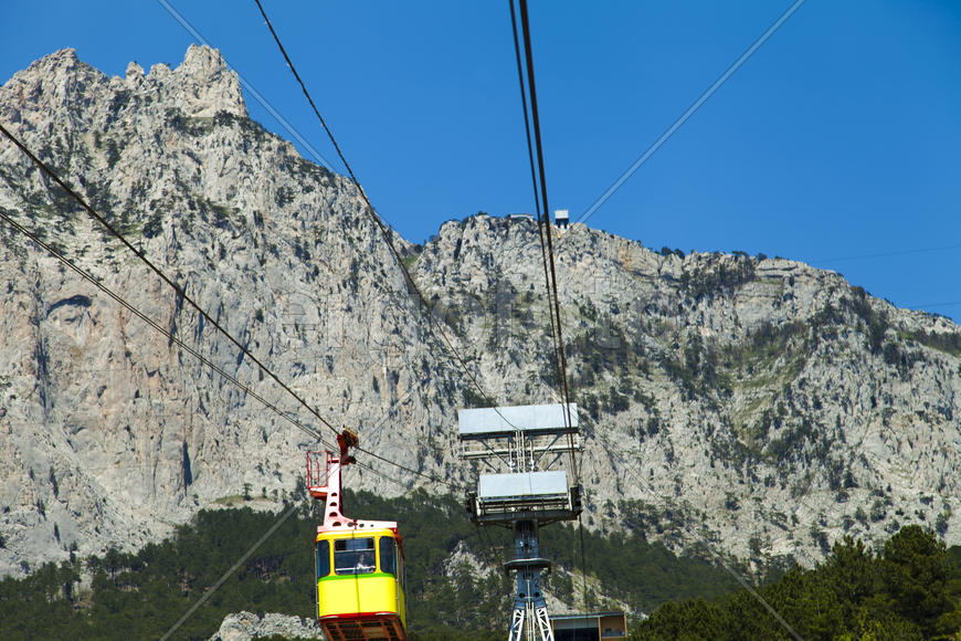 Ropeway on the high mountain in the sunny day